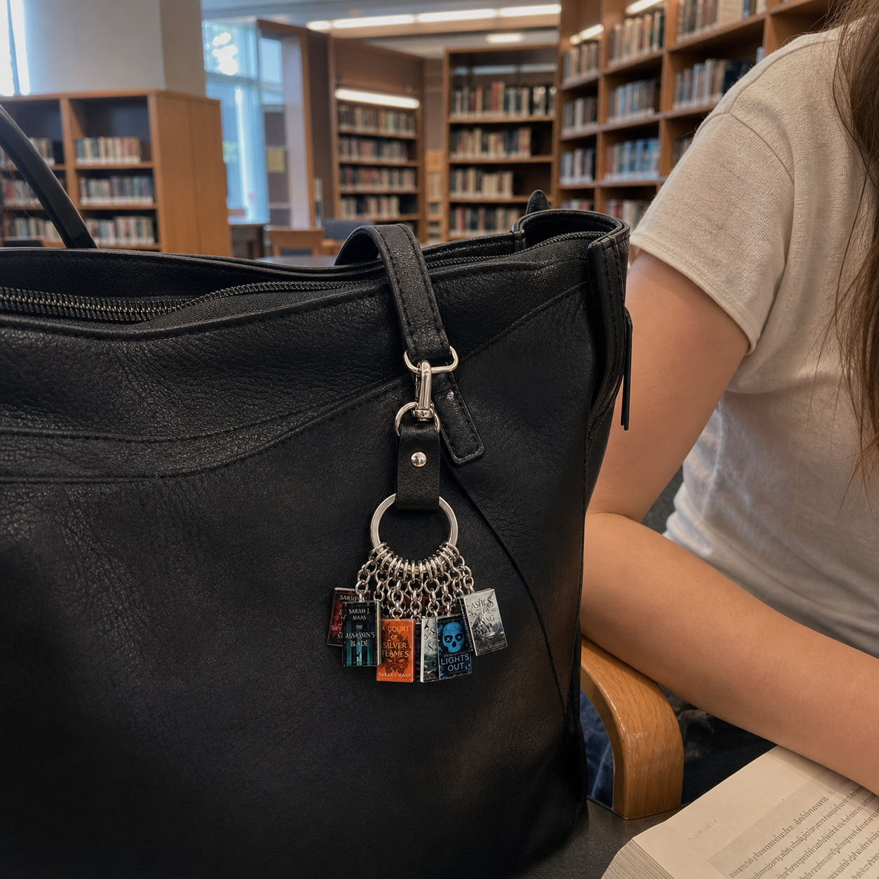Custom-designed mini-book keychains, personalized bag charms for book lovers, and perfect gifts for readers, librarians, teachers, and graduates.