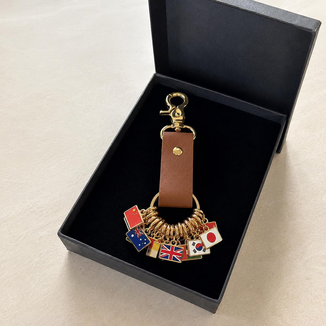 Personalized leather key fob with flag, custom country tag for travel bags, gift for travelers